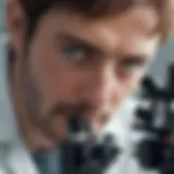 A researcher examining biological samples under a microscope