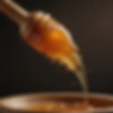 Crude Honey Dripping from a Wooden Dipper A close-up of crude honey dripping from a wooden dipper